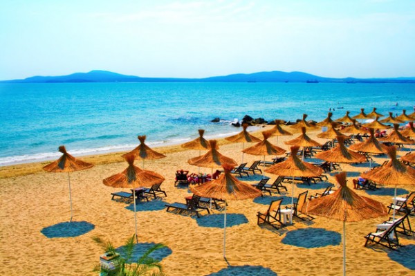 Straw umbrellas on peaceful beach in Bulgaria