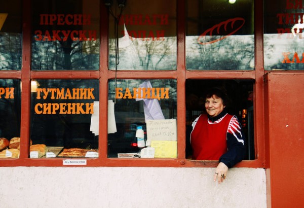 [UNVERIFIED CONTENT] 29 November 2012: shop-keeper at a small bakery in downtown Sofia, Bulgaria, inviting customers with a smile